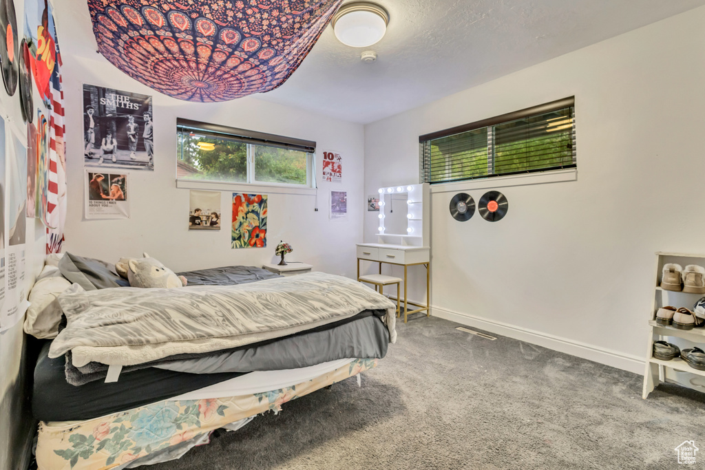 Carpeted bedroom with baseboards