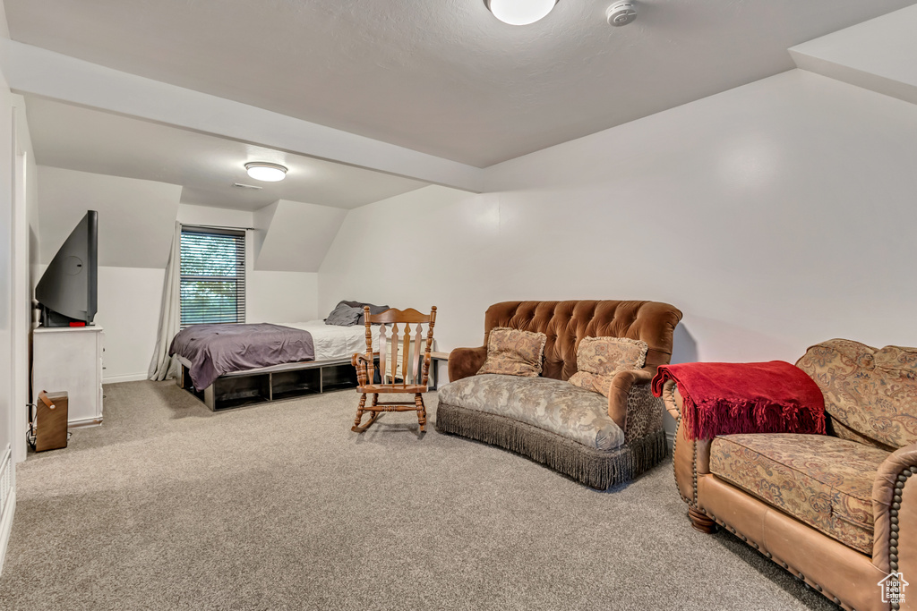Bedroom featuring carpet flooring and baseboards