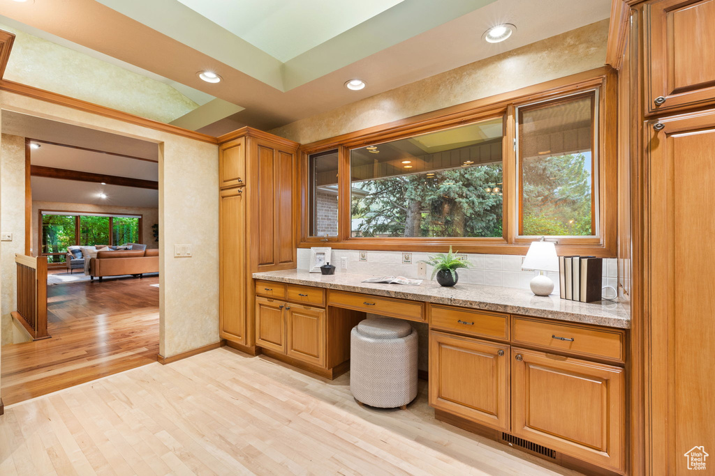 Bathroom with a sink, recessed lighting, visible vents, and wood finished floors