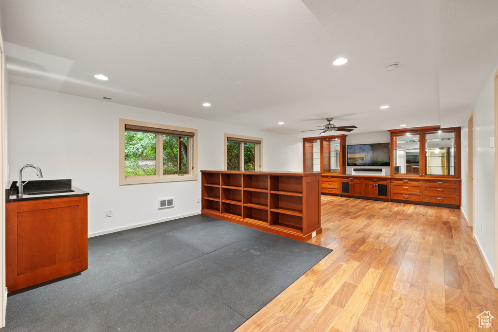Bar featuring baseboards, recessed lighting, visible vents, and a sink