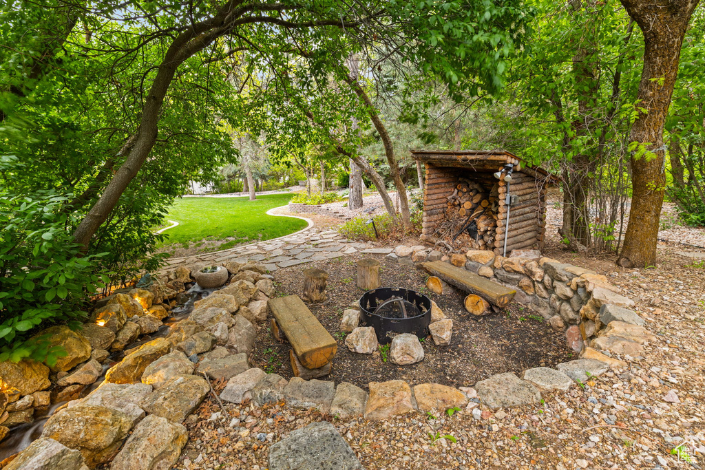 View of yard with a fire pit