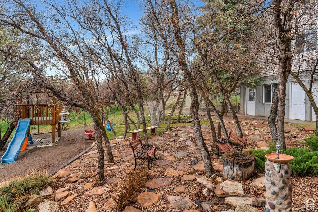 View of yard featuring a playground