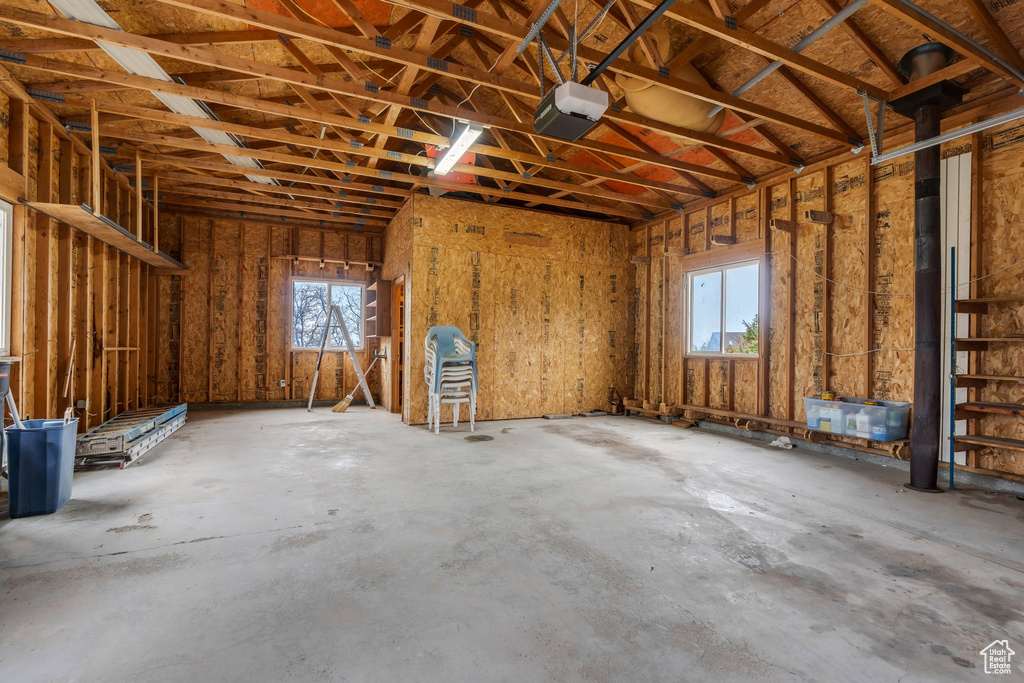 Misc room with healthy amount of natural light and a garage