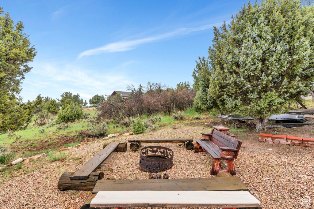 View of community with an outdoor fire pit