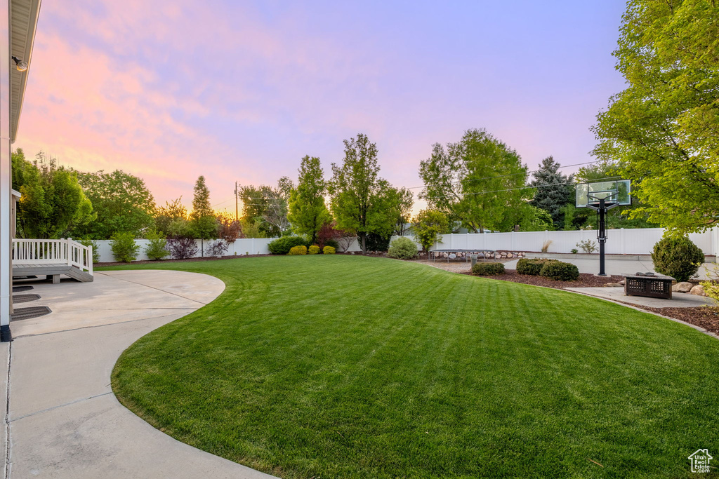 View of yard featuring a patio area and a fire pit
