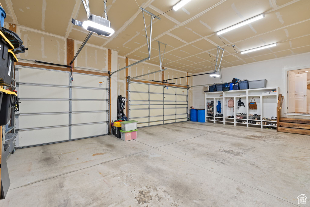 Garage featuring a garage door opener