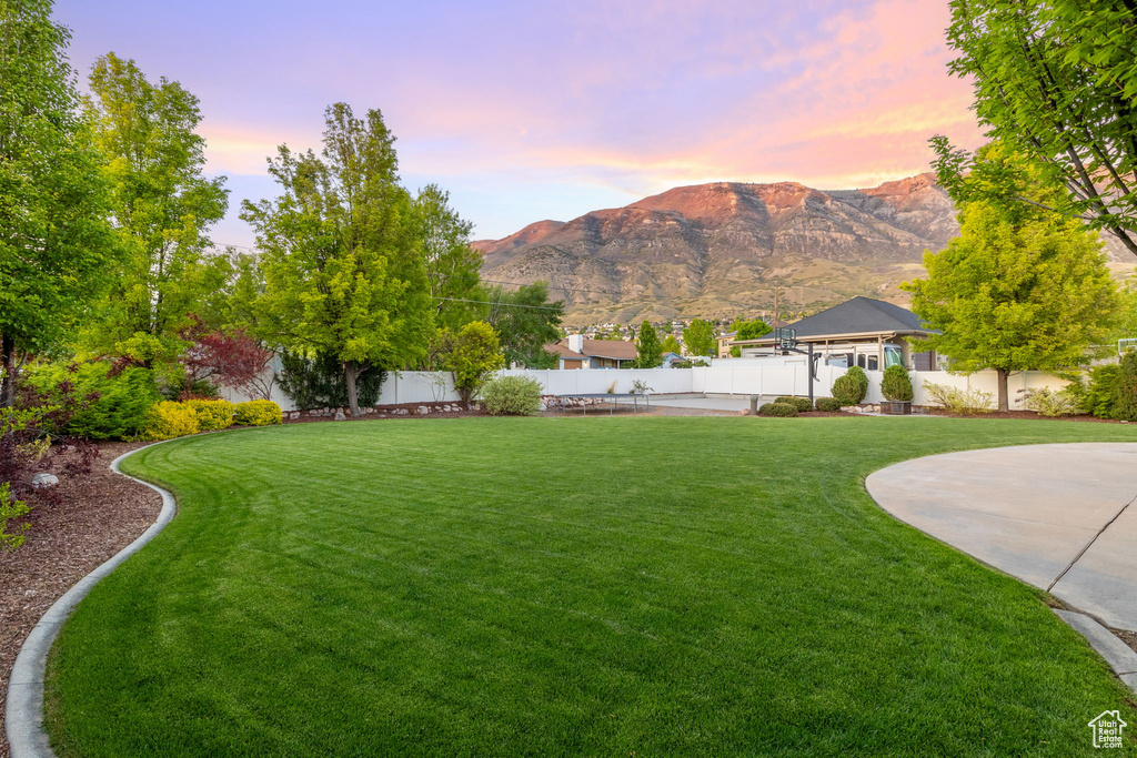 Yard at dusk with a mountain view
