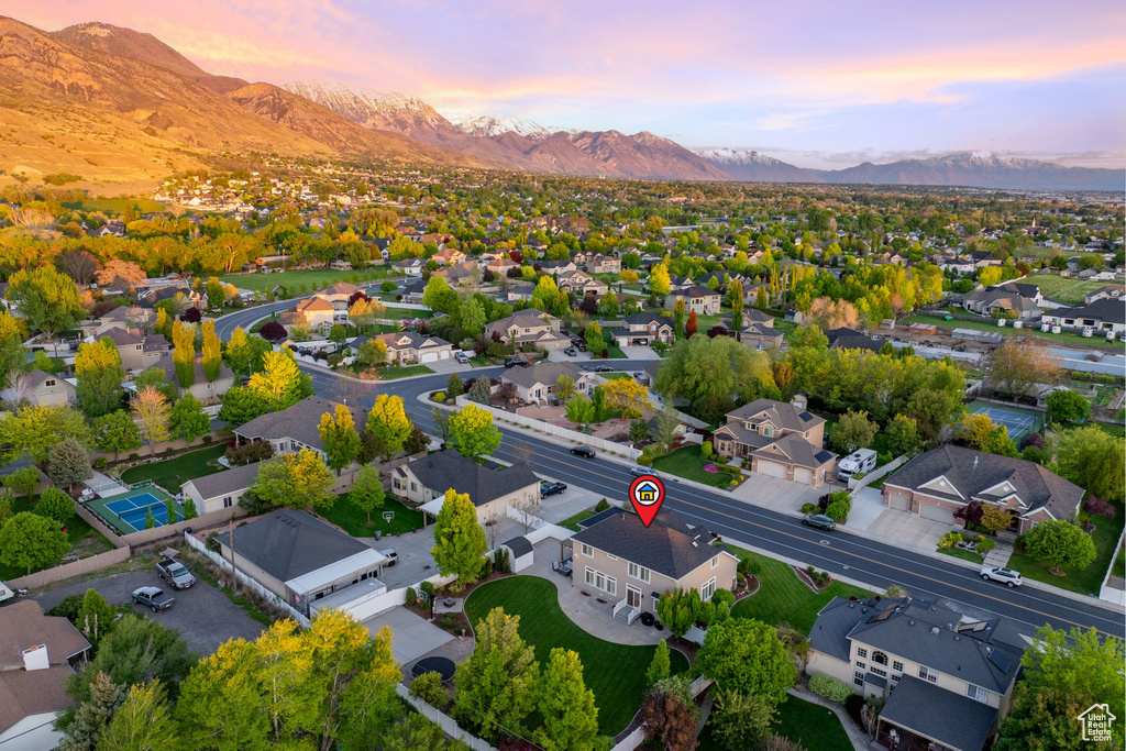 Aerial view of residential area featuring a mountainous background