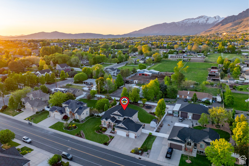 Aerial perspective of suburban area with a mountainous background
