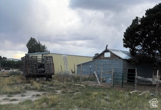 View of outdoor structure with an outbuilding