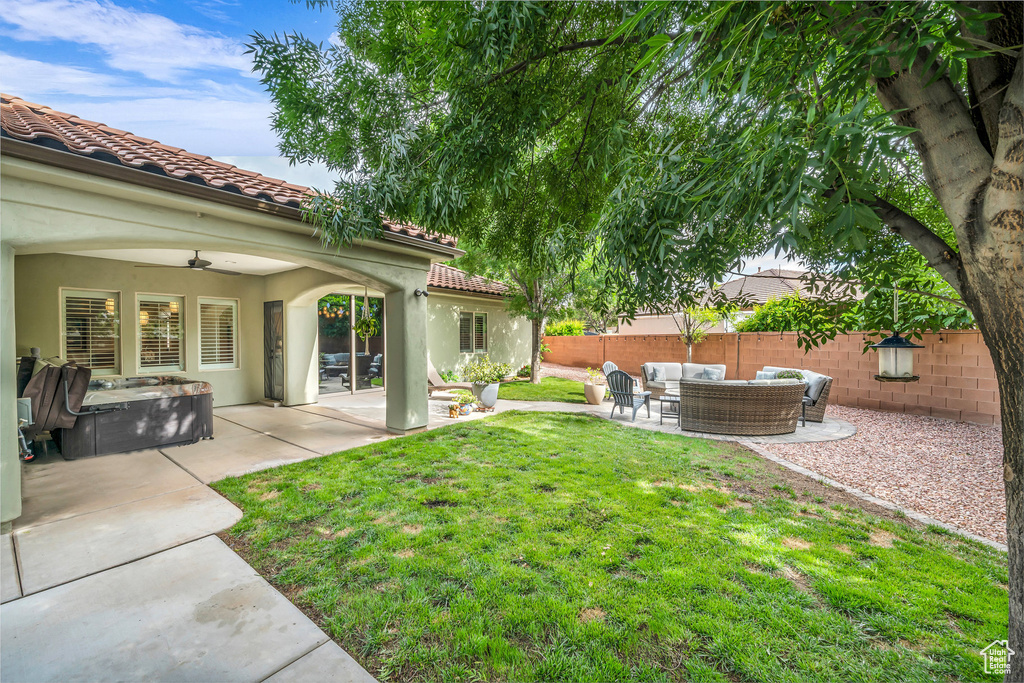 View of yard with outdoor lounge area and a patio area