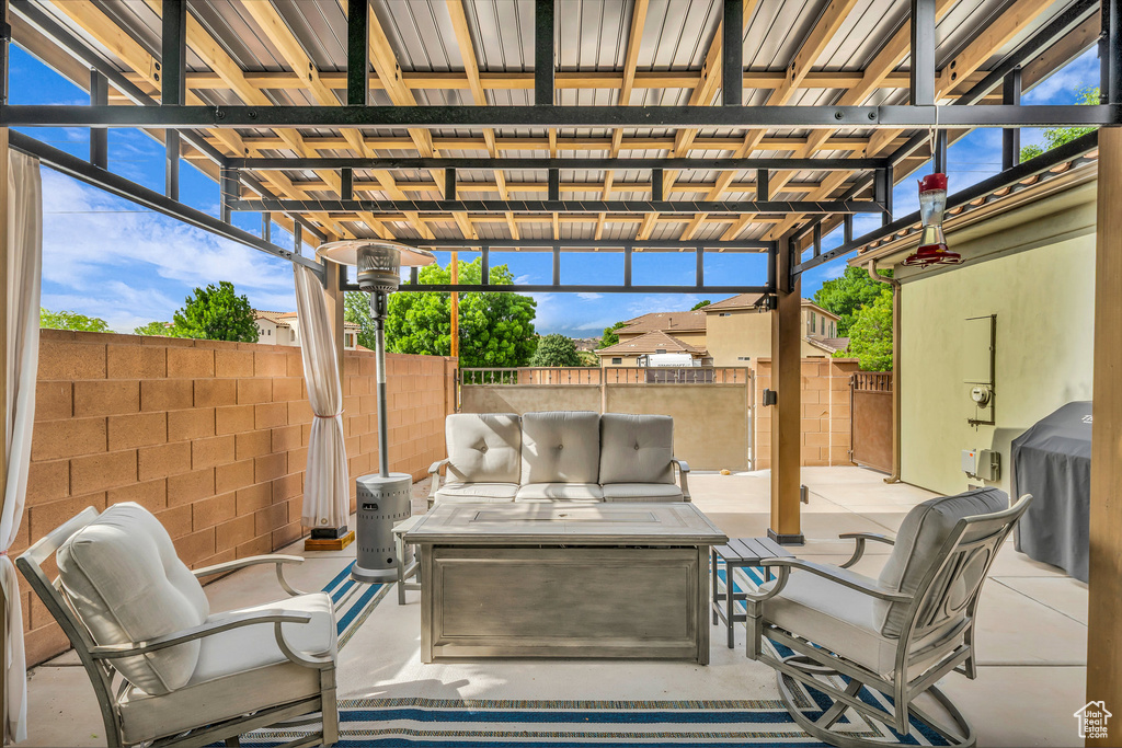View of patio featuring an outdoor hangout area and a fenced backyard
