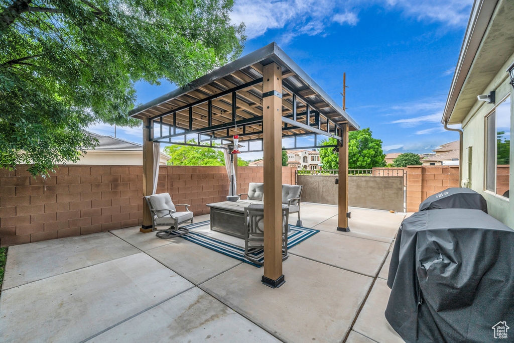 View of patio / terrace featuring grilling area and a fenced backyard