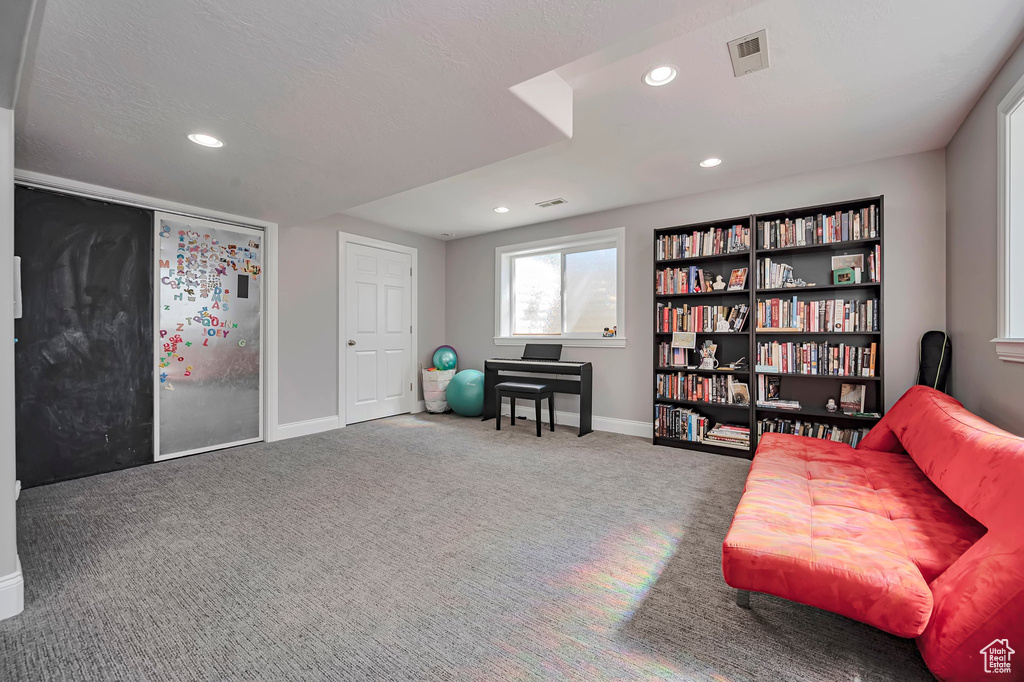 Sitting room featuring baseboards, recessed lighting, and carpet flooring