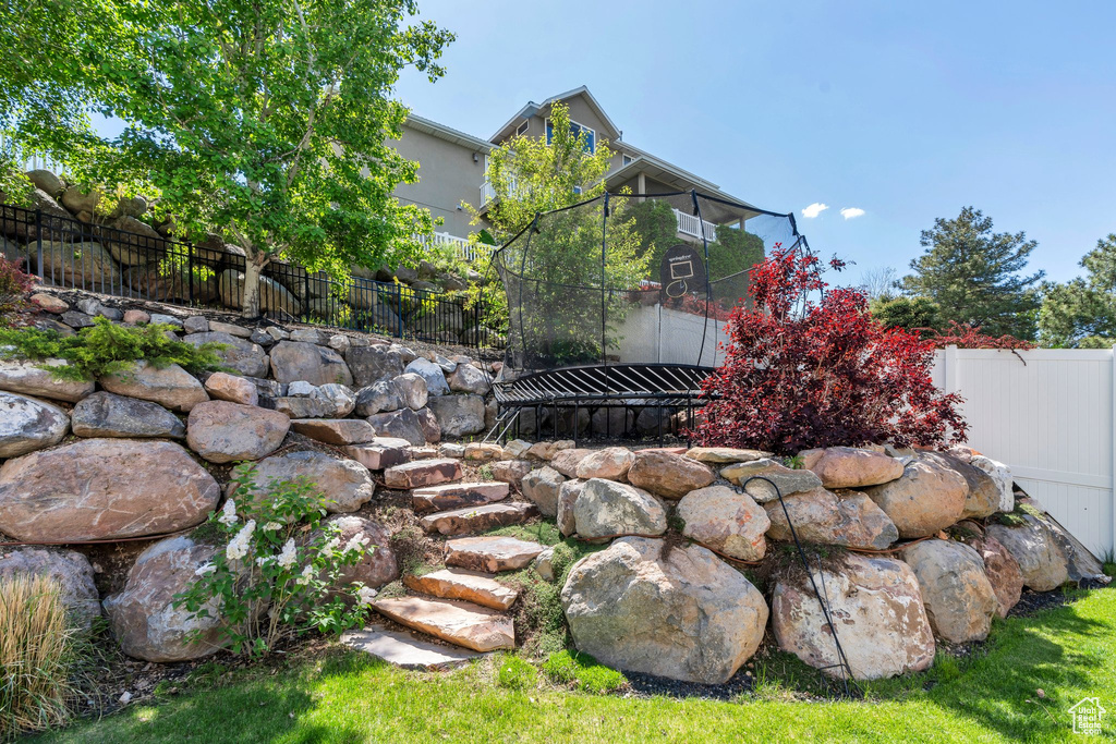 View of yard featuring fence