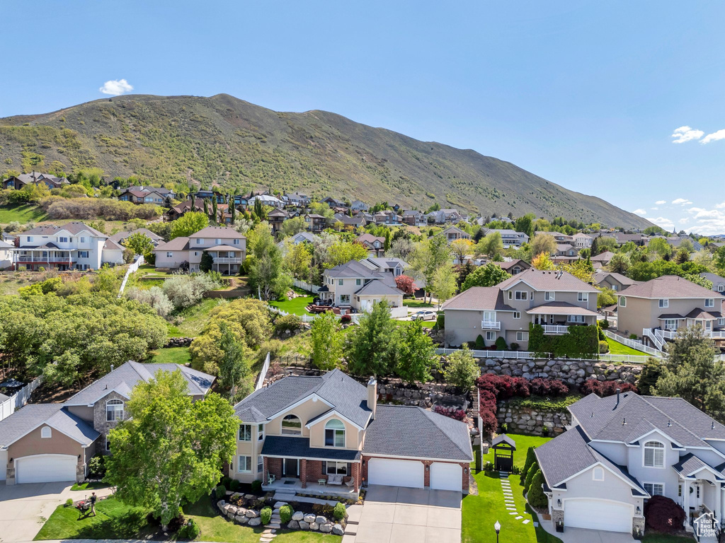 Aerial view of residential area with a mountainous background