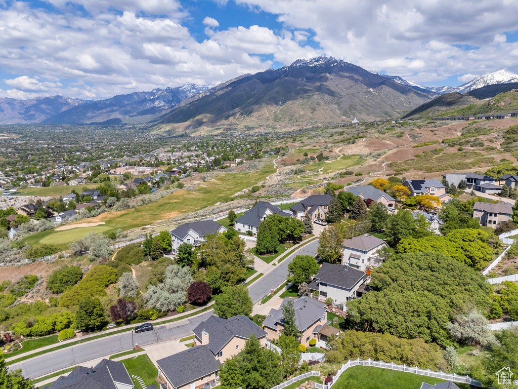 Aerial view of residential area featuring a mountainous background