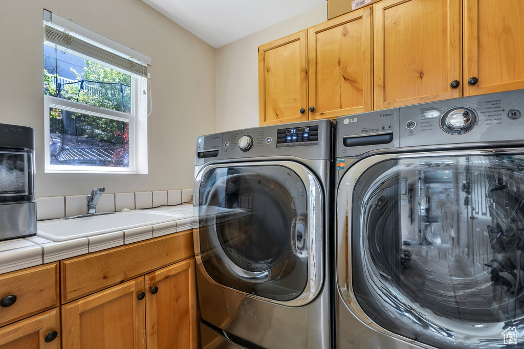 Washroom with cabinet space and separate washer and dryer
