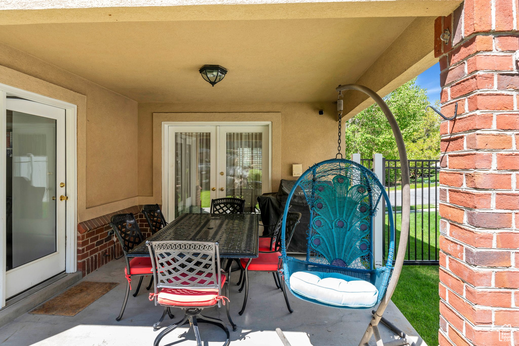 View of patio with outdoor dining space and french doors
