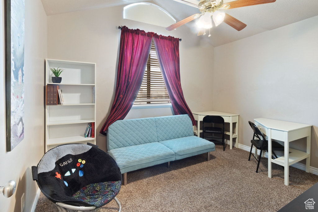 Sitting room featuring carpet flooring, ceiling fan, and baseboards
