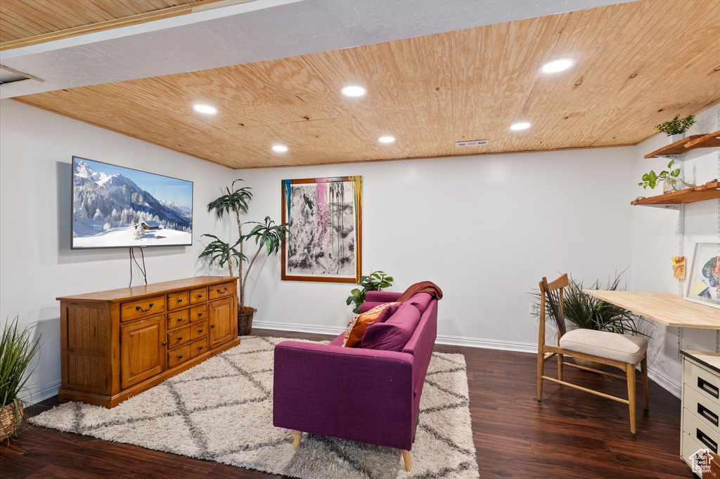 Sitting room with wood ceiling, dark wood-style flooring, baseboards, and recessed lighting