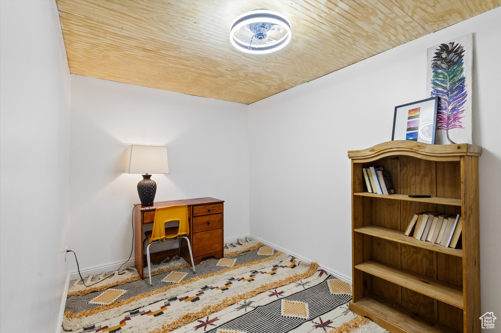 Office area featuring baseboards and wooden ceiling
