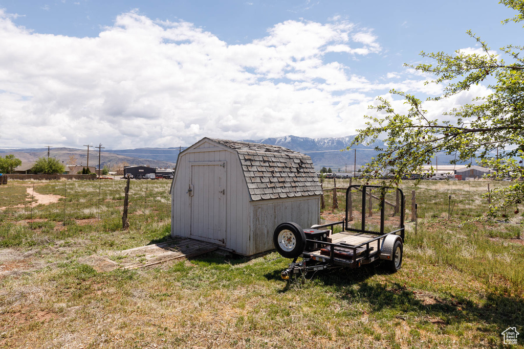 View of shed featuring a mountain view and a view of rural / pastoral area
