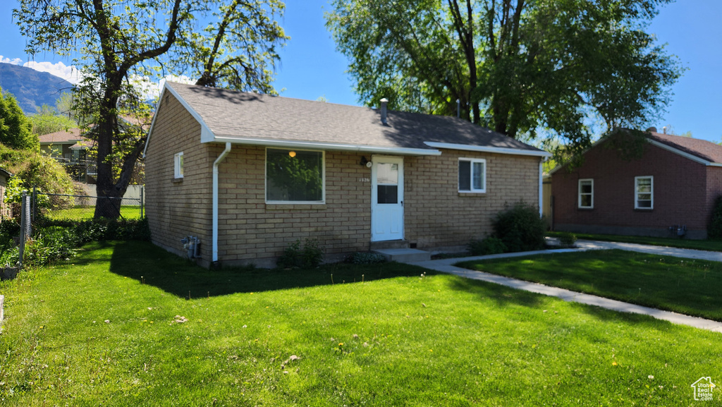 View of front of home with entry steps and a mountain view