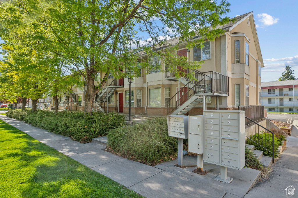 View of property's community with mail area and stairway