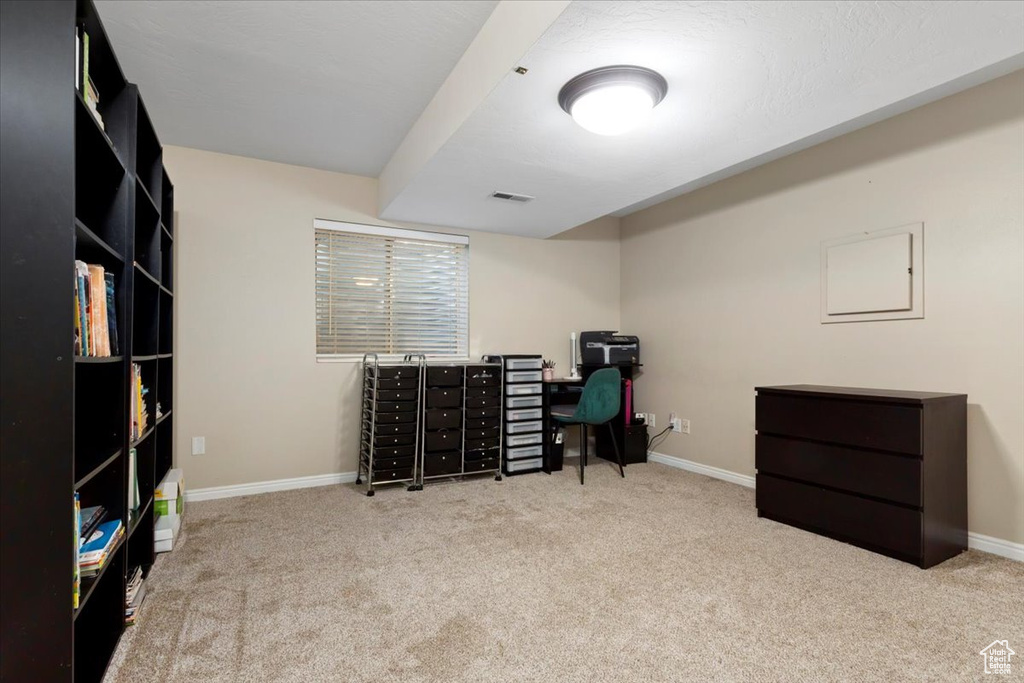 Office area featuring carpet floors and baseboards