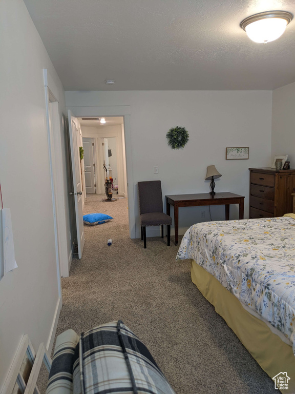 Carpeted bedroom with baseboards