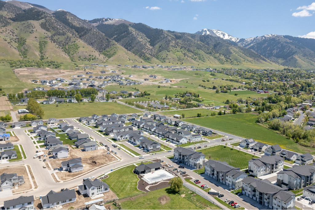 View of property location featuring a mountain backdrop and nearby suburban area