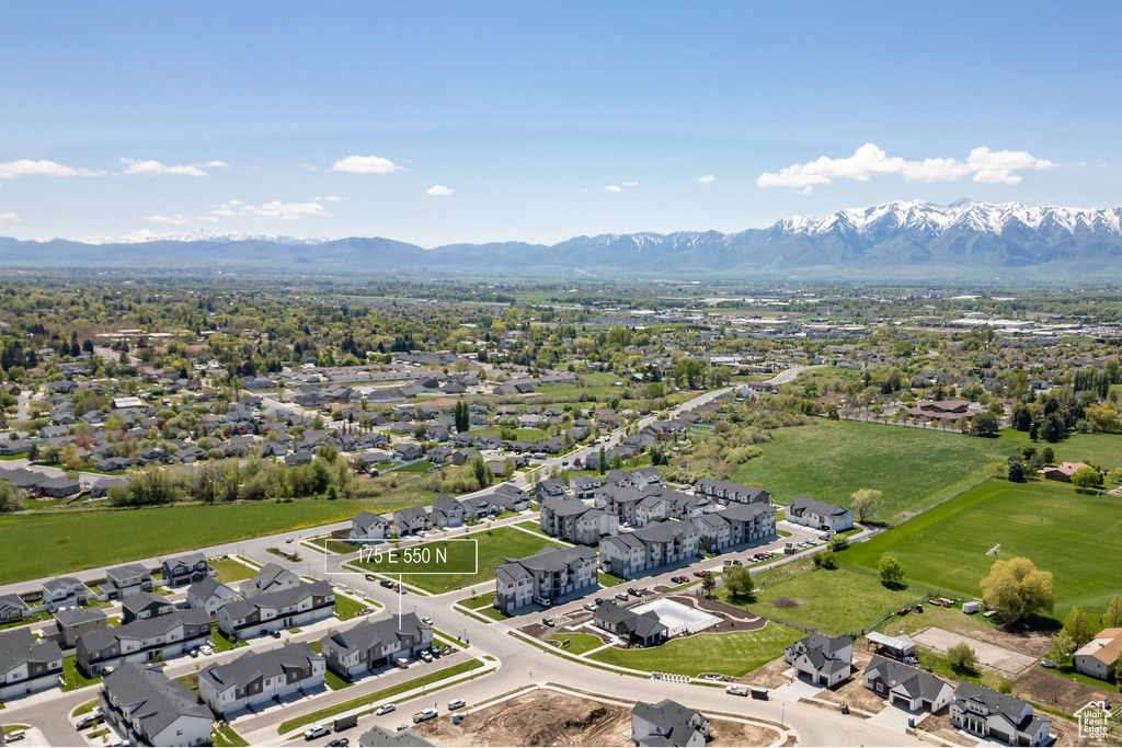 Aerial perspective of suburban area with a mountain backdrop