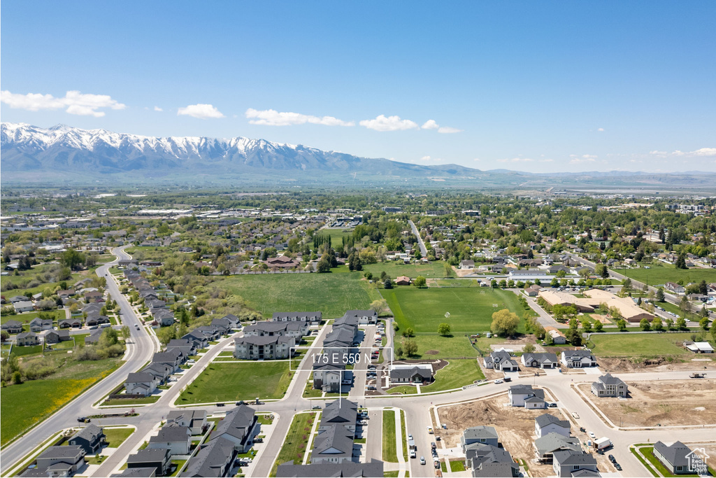 Aerial perspective of suburban area featuring a mountainous background