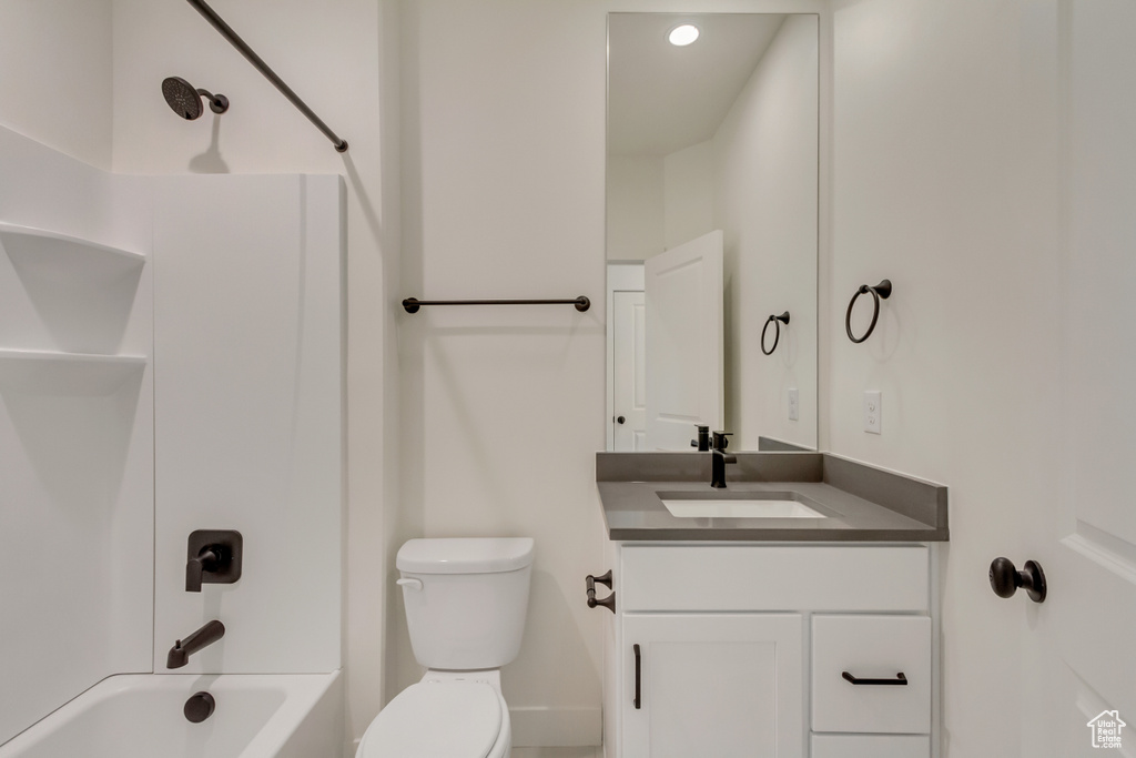Full bathroom with toilet, vanity, and bathtub / shower combination