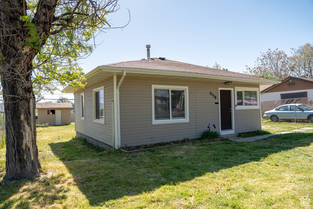 Exterior space featuring a front yard