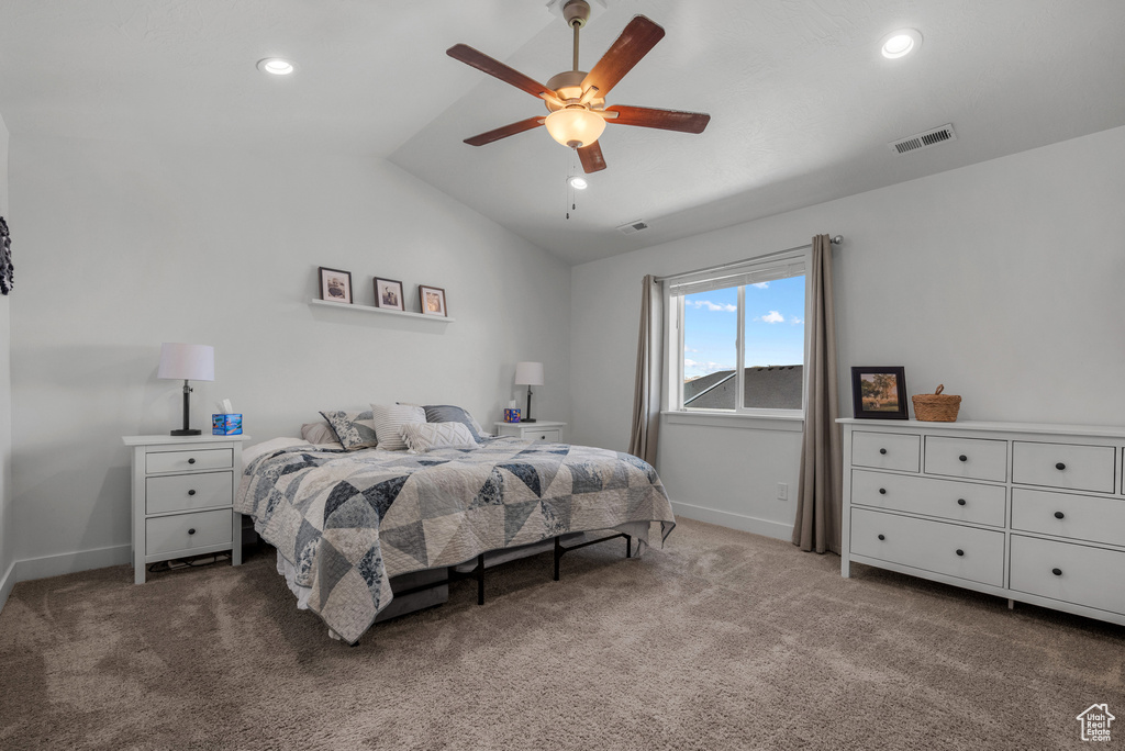 Bedroom featuring vaulted ceiling, carpet flooring, baseboards, recessed lighting, and a ceiling fan