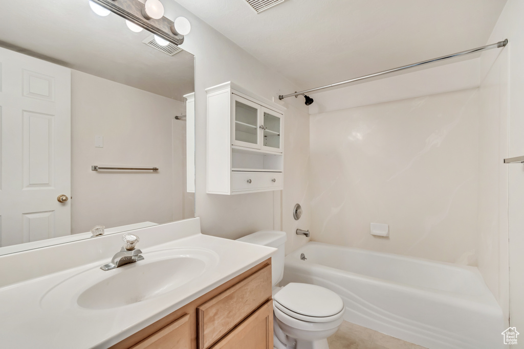 Full bathroom with bathing tub / shower combination, toilet, and vanity