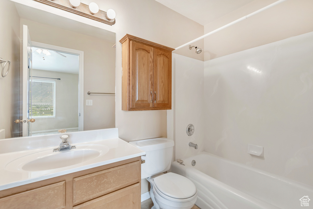 Full bathroom with vanity, toilet, and washtub / shower combination