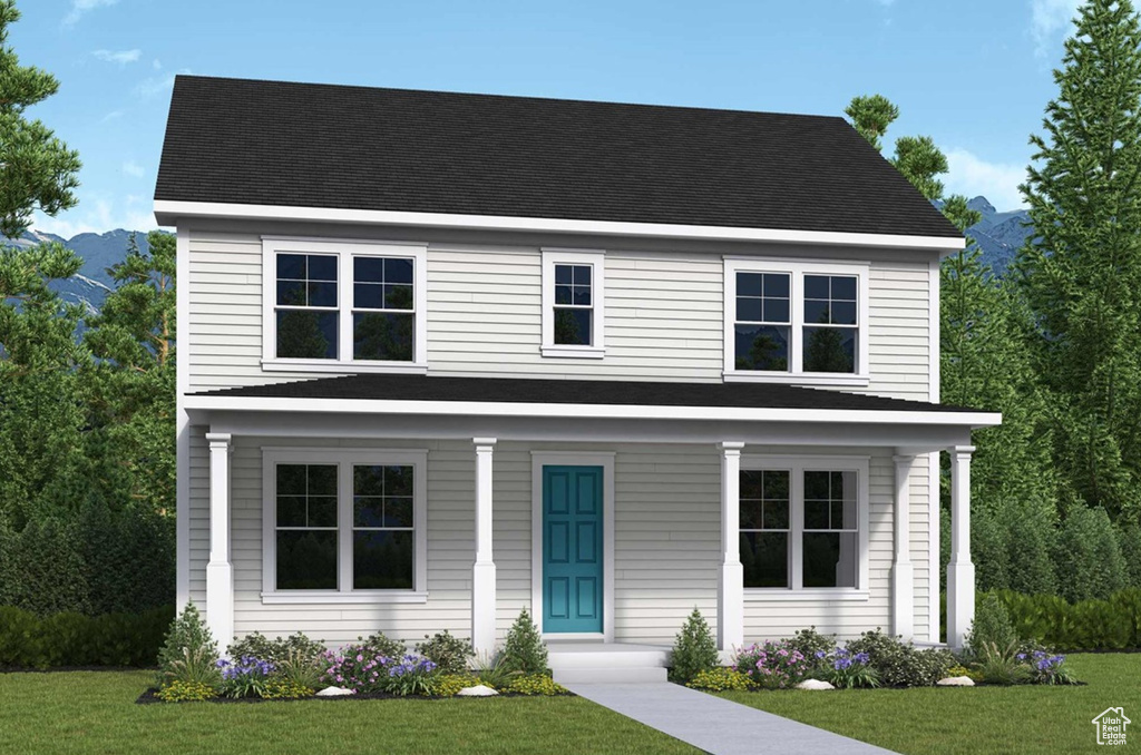 View of front facade featuring a front lawn and a shingled roof
