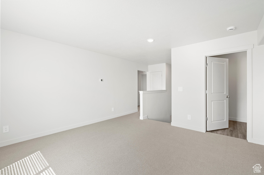 Unfurnished bedroom with carpet flooring and recessed lighting