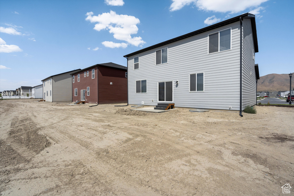Rear view of property featuring entry steps