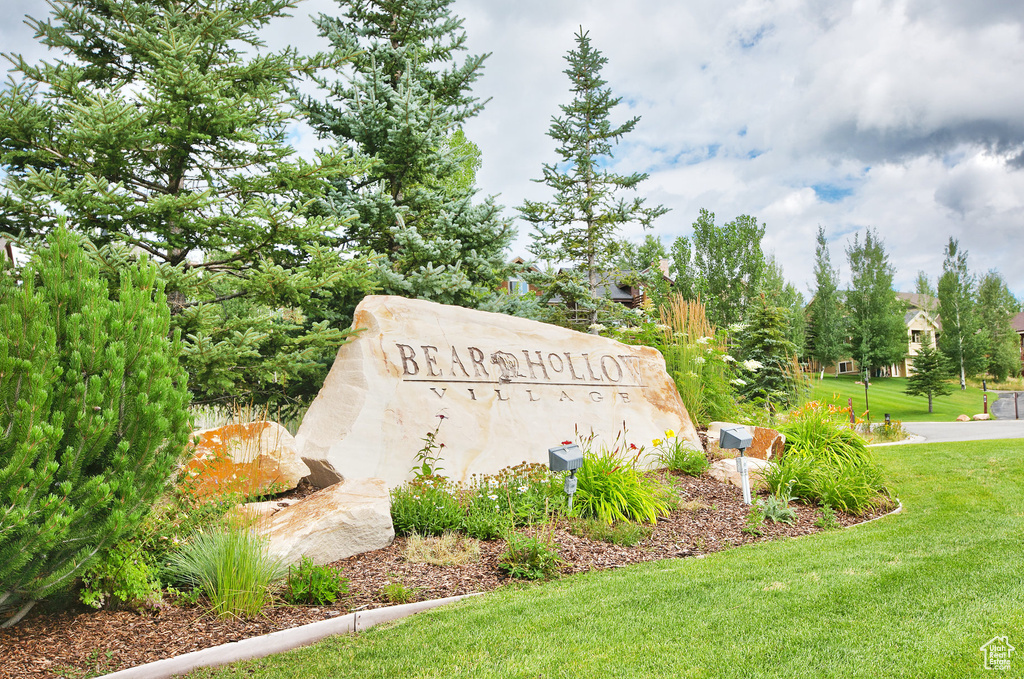 Community / neighborhood sign with a lawn