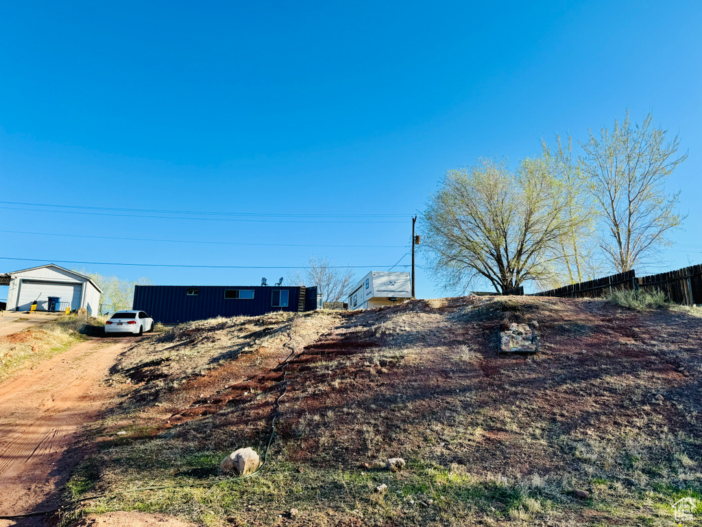 View of yard featuring fence