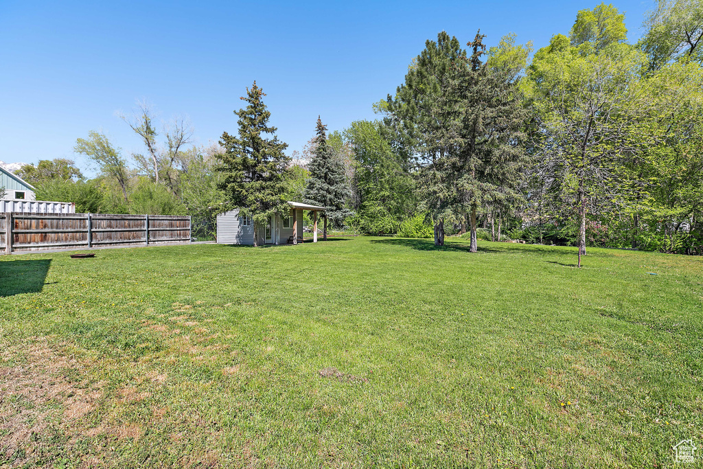 View of yard featuring fence
