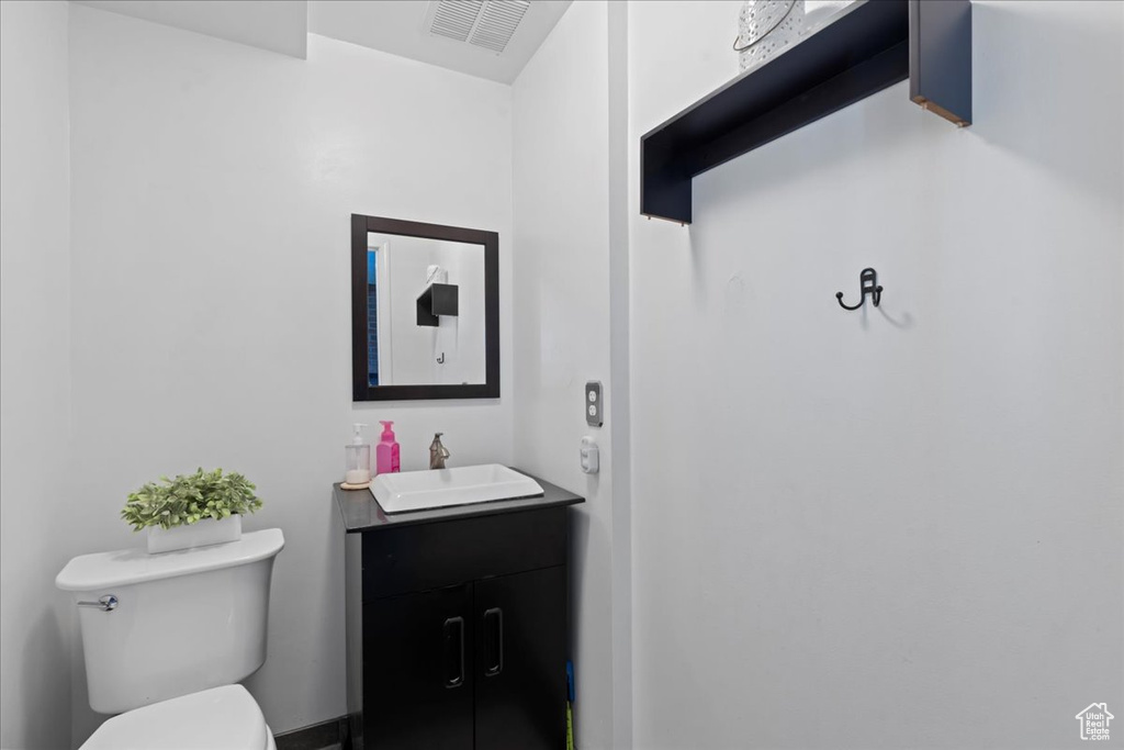 Bathroom featuring toilet and vanity