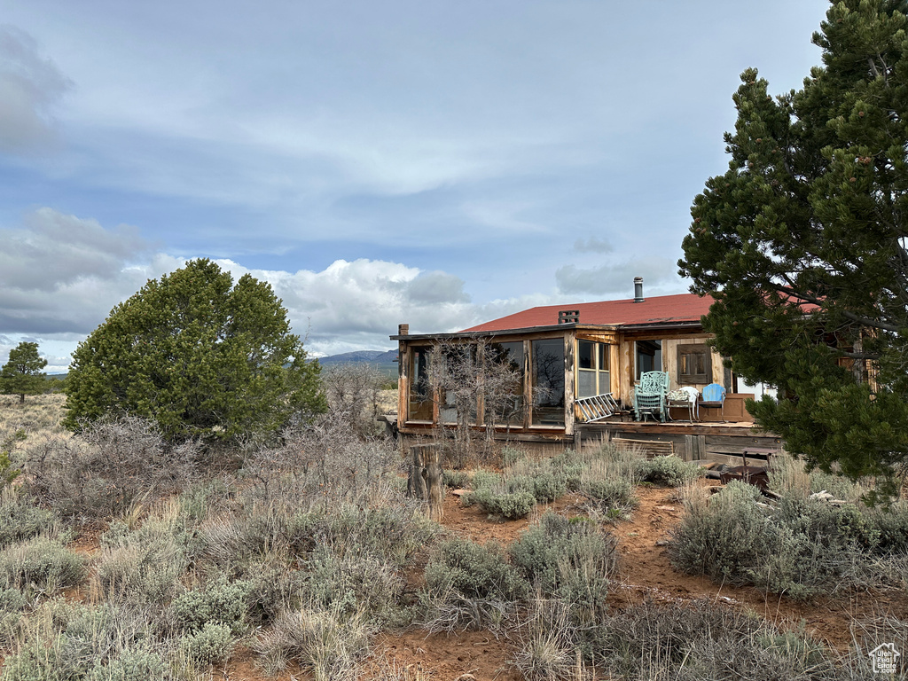 Back of property featuring a wooden deck
