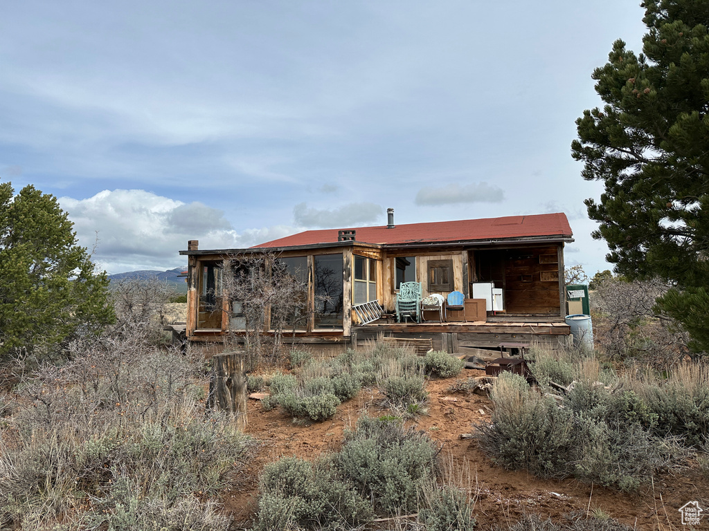 Back of house featuring a sunroom