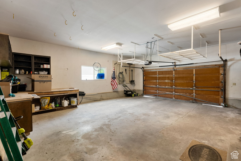 Garage featuring a garage door opener