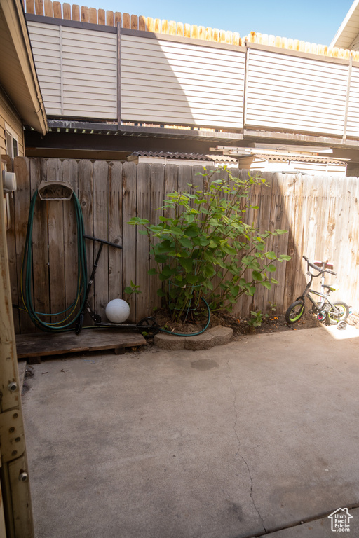 View of patio with fence